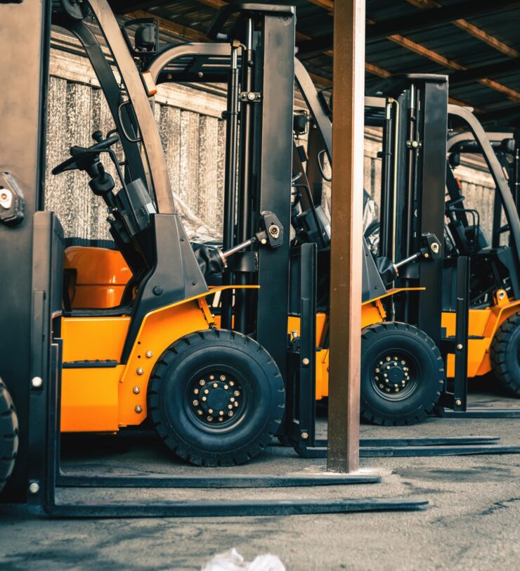 Background of a lot of forklifts, reliable heavy loader, truck. Heavy duty equipment, forklift